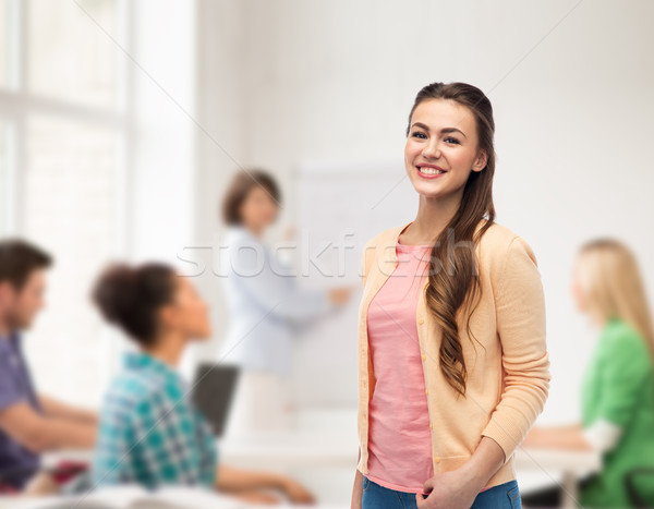 happy smiling young woman in cardigan Stock photo © dolgachov