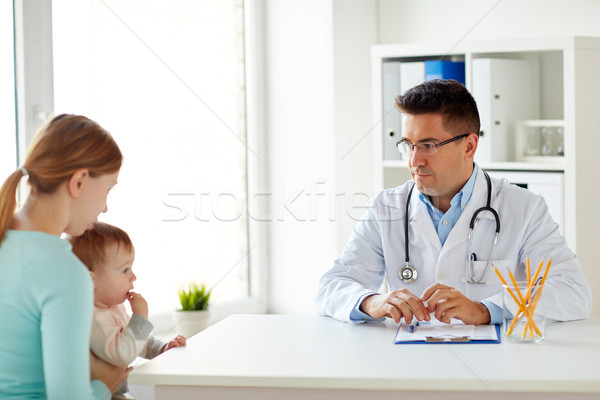 woman with baby and doctor at clinic Stock photo © dolgachov
