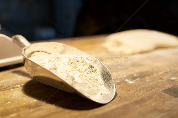 flour in bakery scoop on kitchen table Stock photo © dolgachov