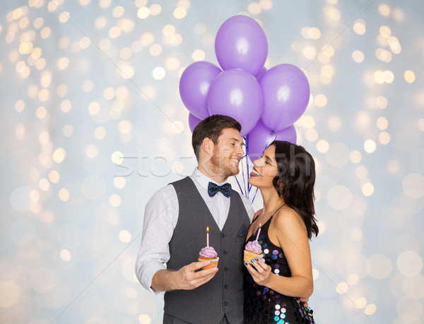happy couple with balloons and cupcakes at party Stock photo © dolgachov