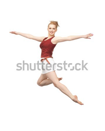 jumping sporty girl Stock photo © dolgachov