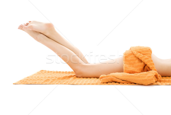 Hosszú lábak nyugodt hölgy narancs törölköző fehér Stock fotó © dolgachov