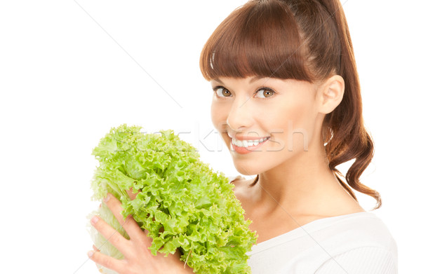 beautiful housewife with lettuce over white Stock photo © dolgachov