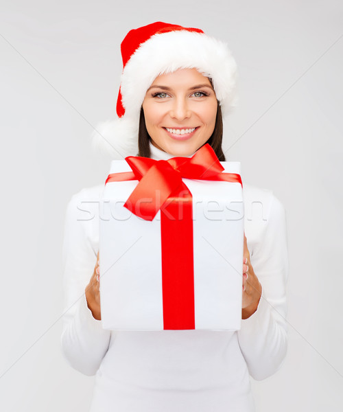 Donna sorridente helper Hat scatola regalo Natale Foto d'archivio © dolgachov