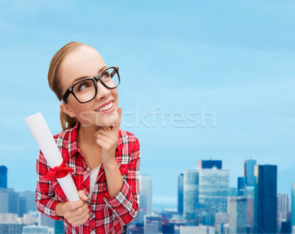 smiling woman in black eyeglasses with diploma Stock photo © dolgachov