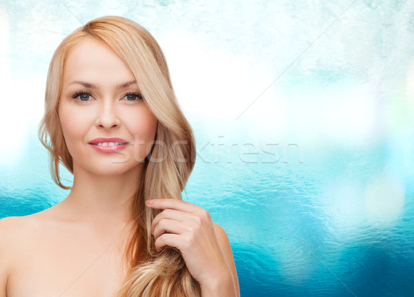 beautiful woman playing with long hair Stock photo © dolgachov