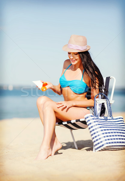 girl sunbathing on the beach chair Stock photo © dolgachov