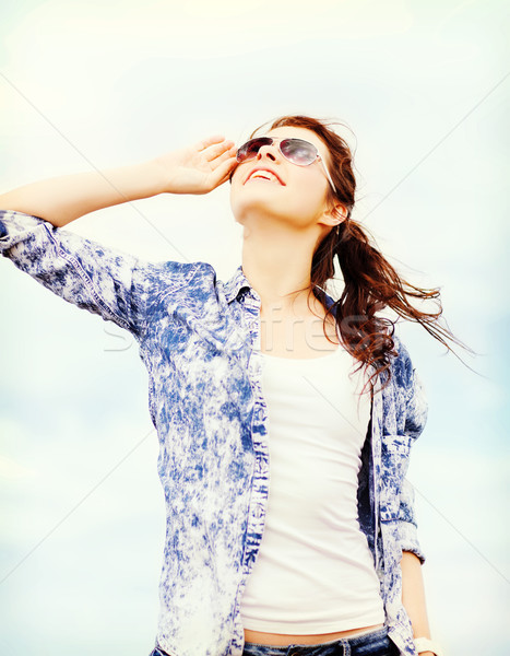 teenage girl in shades outside Stock photo © dolgachov