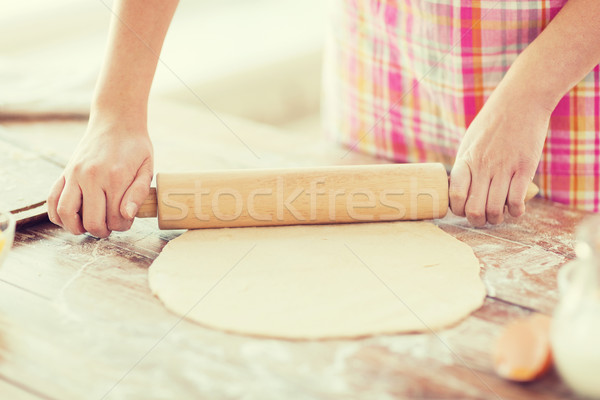 close up of female working with rolling-pin Stock photo © dolgachov