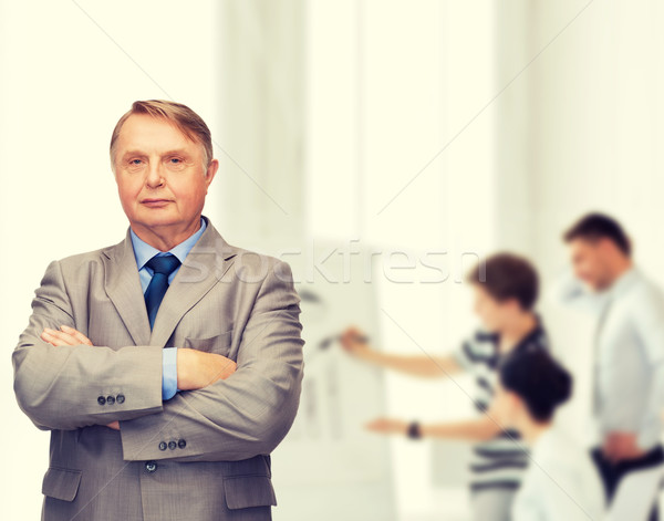 serious businessman or teacher in suit Stock photo © dolgachov