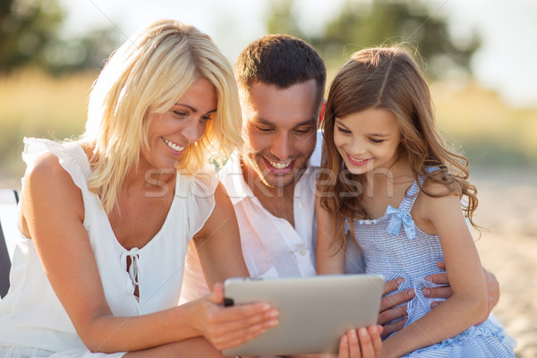 happy family with tablet pc taking picture Stock photo © dolgachov