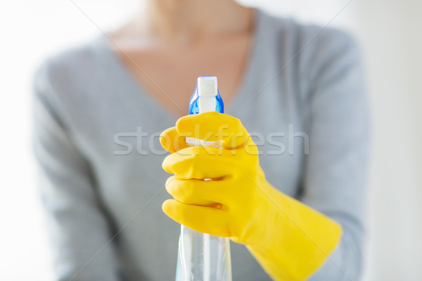 close up of happy woman with cleanser spraying Stock photo © dolgachov