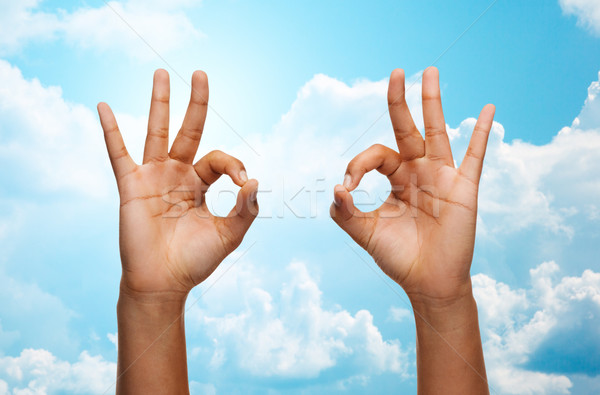Kettő afrikai kezek mutat ok felirat Stock fotó © dolgachov