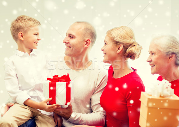 smiling family with gifts at home Stock photo © dolgachov