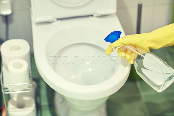 close up of hand with detergent cleaning toilet Stock photo © dolgachov