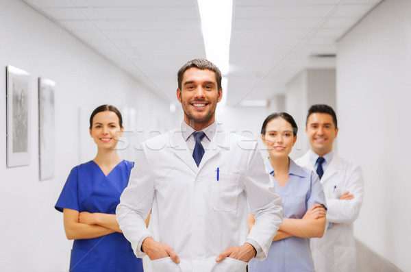 happy group of medics or doctors at hospital Stock photo © dolgachov