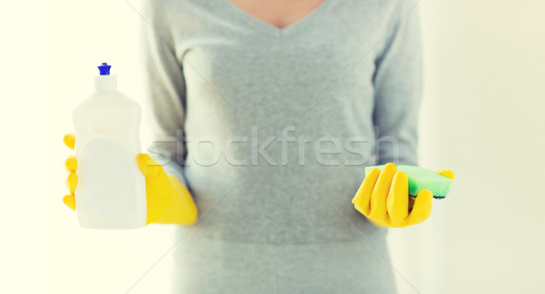 close up of woman with sponge and cleanser Stock photo © dolgachov