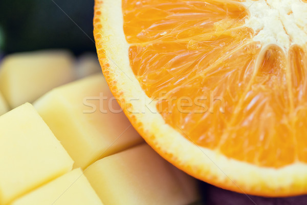 close up of fresh juicy orange and mango slices Stock photo © dolgachov