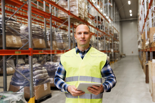 manual worker with tablet pc at warehouse Stock photo © dolgachov