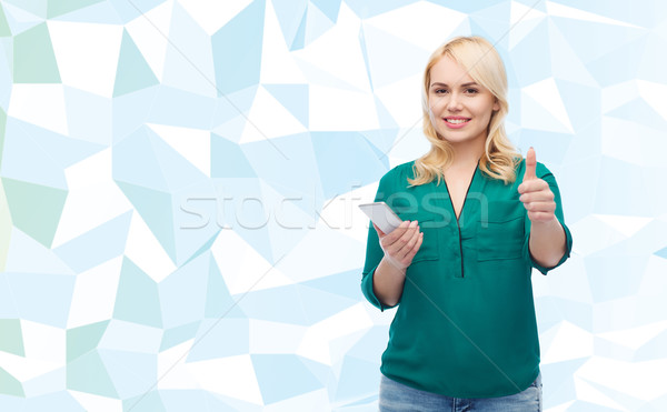 happy woman with smartphone texting message Stock photo © dolgachov