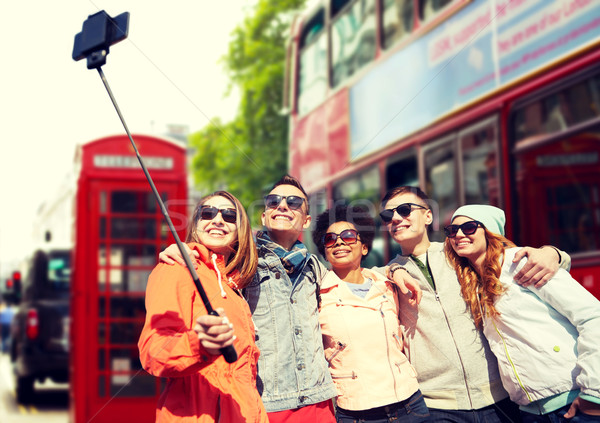 friends taking selfie with smartphone in london Stock photo © dolgachov