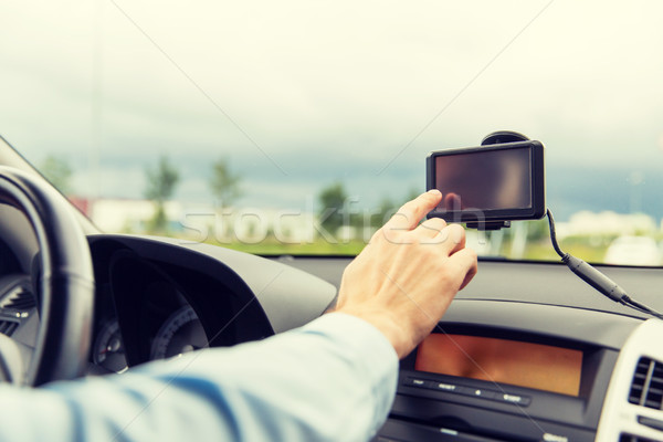 close up of man with gps navigator driving car Stock photo © dolgachov