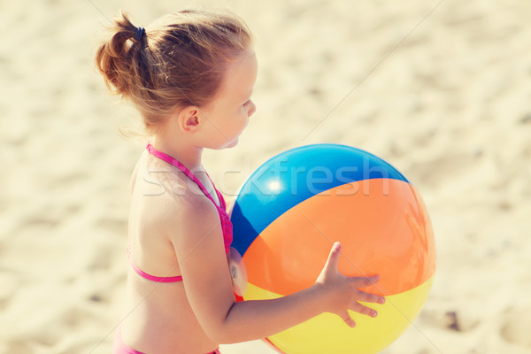 Heureux petite fille jouer gonflable balle plage [[stock_photo]] © dolgachov