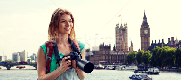 Stock photo: woman with backpack and camera over london big ben