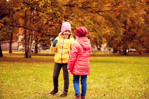 two happy little girls in autumn park Stock photo © dolgachov