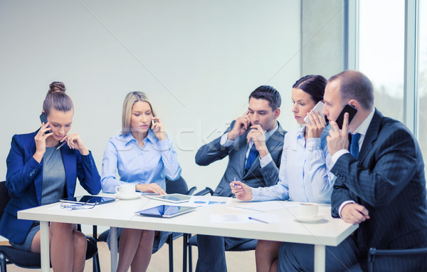 business team with smartphones having conversation Stock photo © dolgachov