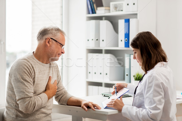senior man and doctor meeting at hospital Stock photo © dolgachov