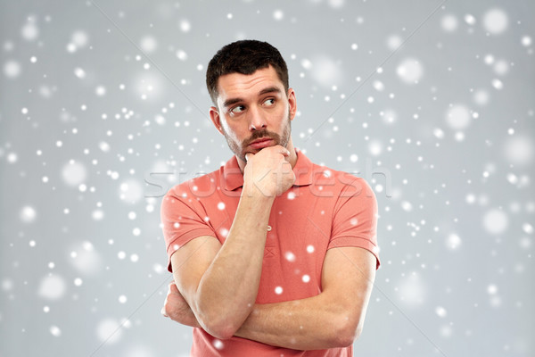 man thinking over snow background Stock photo © dolgachov
