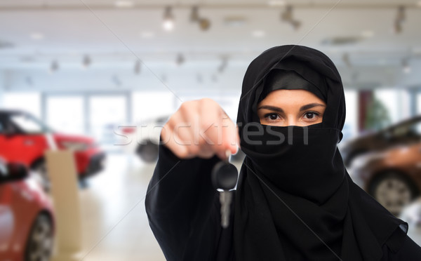 muslim woman in hijab with car key over car show Stock photo © dolgachov