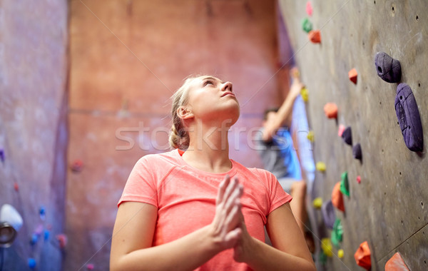 young woman exercising at indoor climbing gym wall Stock photo © dolgachov