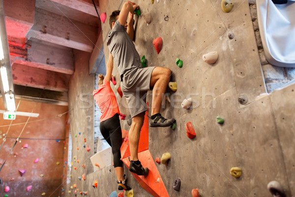 man and woman exercising at indoor climbing gym Stock photo © dolgachov