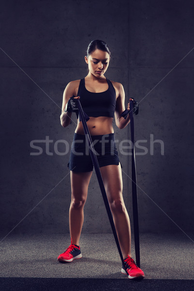 woman with expander exercising in gym Stock photo © dolgachov