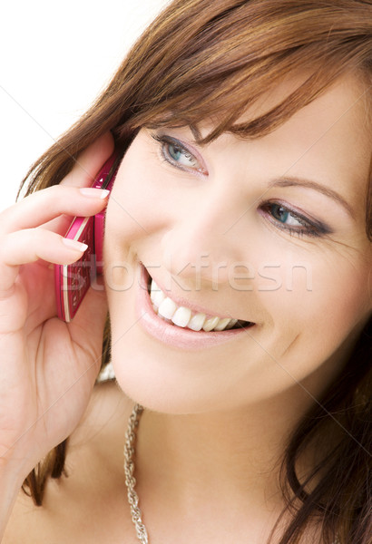 woman with pink phone Stock photo © dolgachov