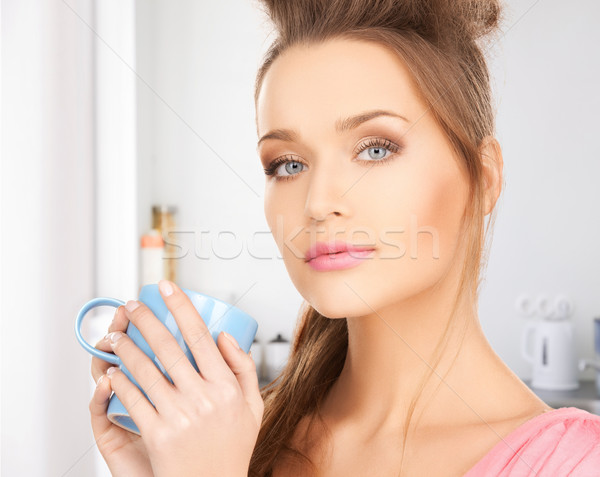 woman with mug Stock photo © dolgachov