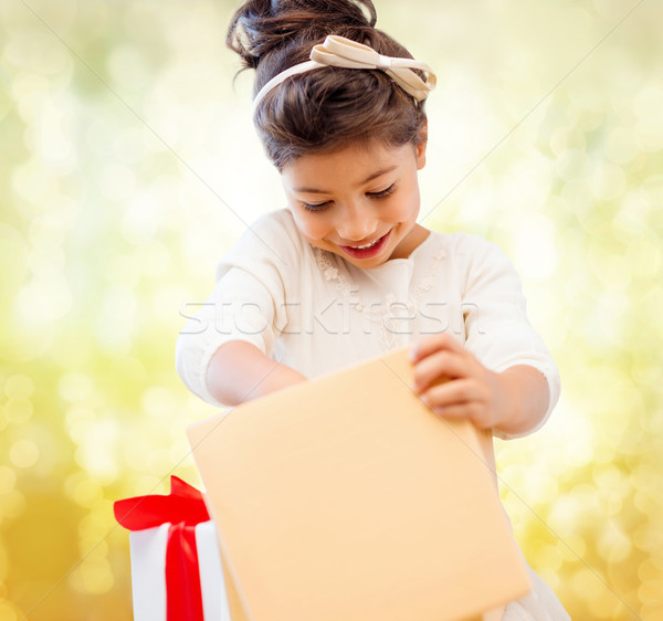 happy child girl with gift box Stock photo © dolgachov