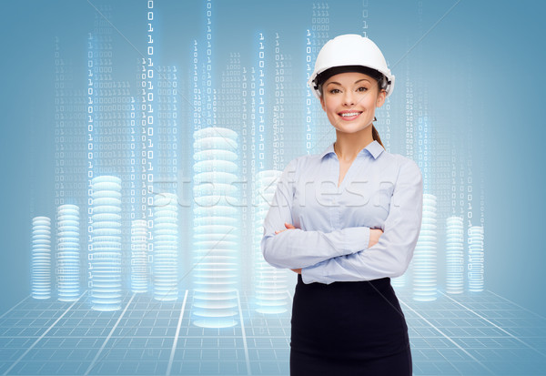 friendly smiling businesswoman in white helmet Stock photo © dolgachov