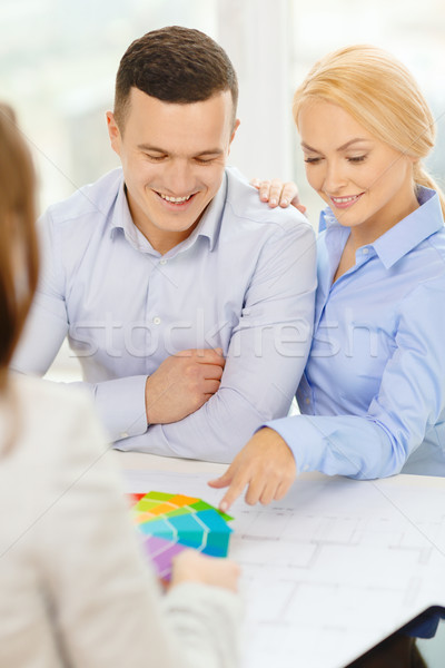 couple looking at blueprint and color samples Stock photo © dolgachov