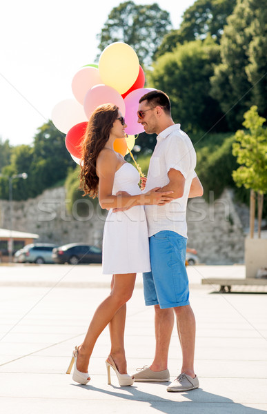 Stock photo: smiling couple in city