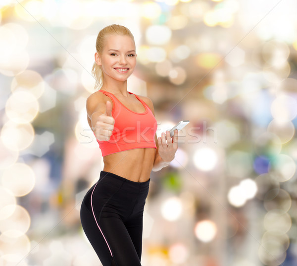 Lächelnd sportlich Frau Smartphone Sport Fitness Stock foto © dolgachov