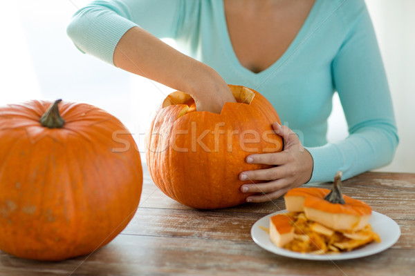 close up of woman with pumpkins at home Stock photo © dolgachov