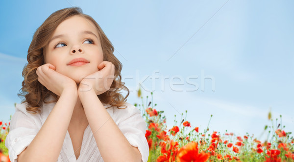 beautiful girl sitting at table and looking up Stock photo © dolgachov