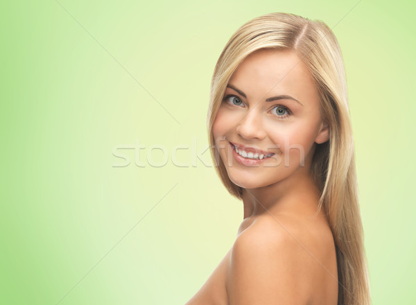 face of beautiful young happy woman with long hair Stock photo © dolgachov