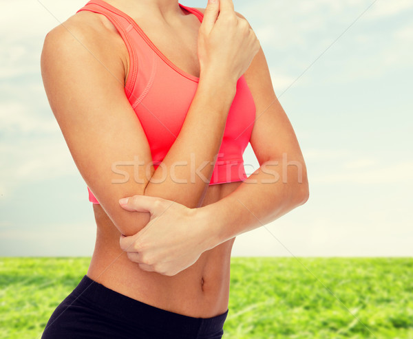 Stock photo: sporty woman with pain in elbow