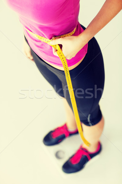 Geschult Bauch Maßband Sport Ernährung Frau Stock foto © dolgachov