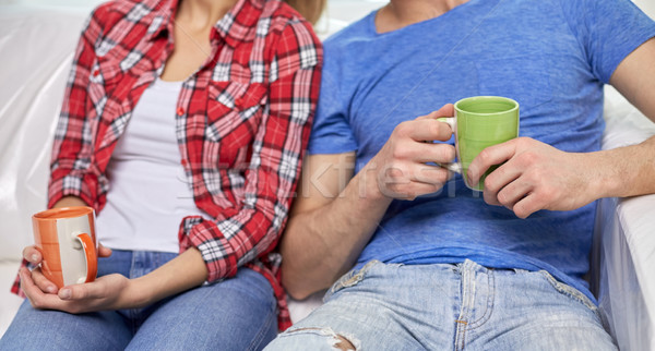 close up of couple relaxing on sofa in new home Stock photo © dolgachov