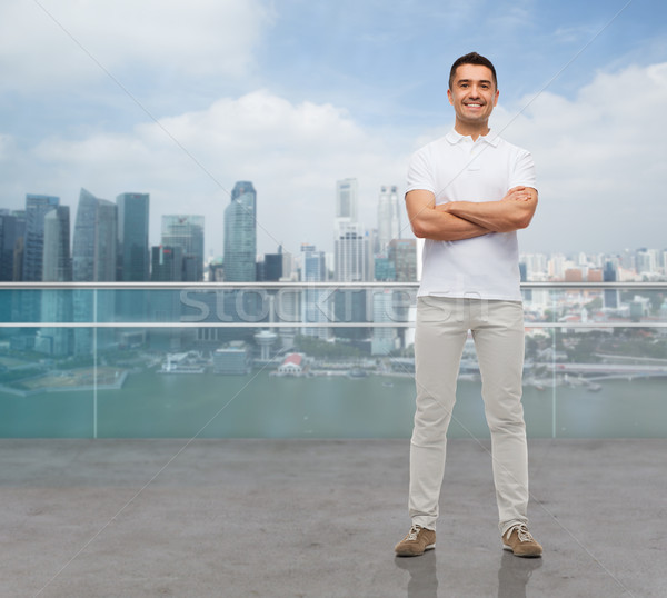 smiling man with crossed arms Stock photo © dolgachov